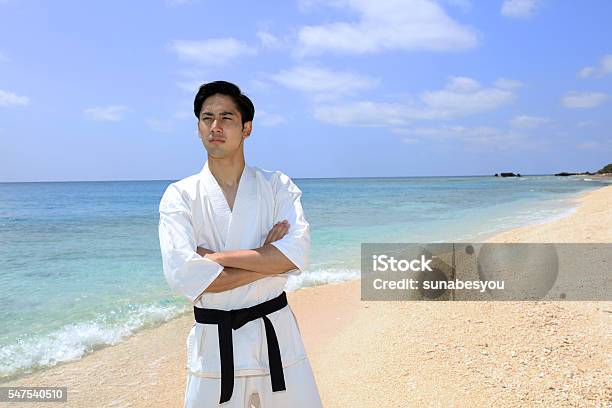 One Asian Man Karate On The Coast Stock Photo - Download Image Now - Beach, East Asia, Healthy Lifestyle