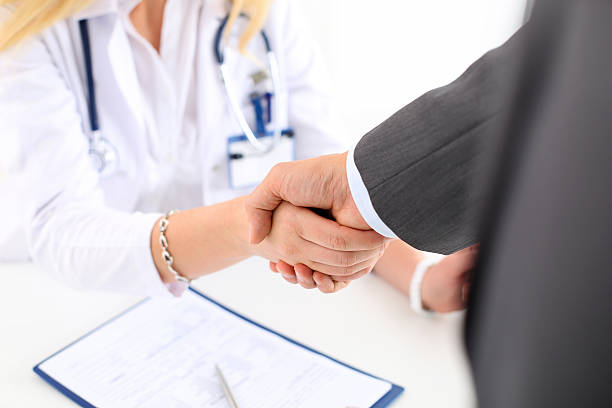 istock Female medicine doctor shake hand as hello 547540680