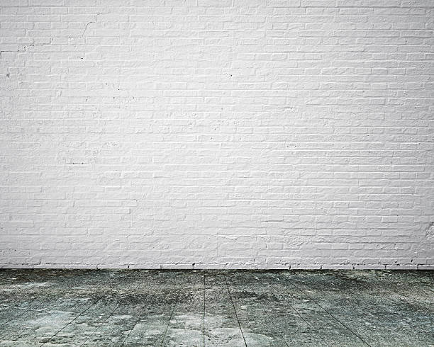 istock Dirty old wooden floor with white bricks wall, background 547540910