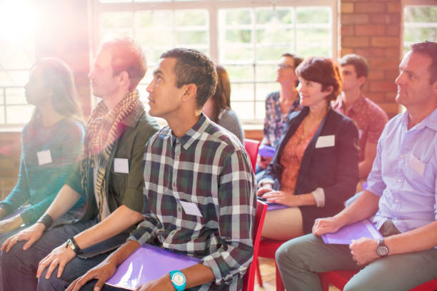 istock Attentive audience listening in community center 554392303
