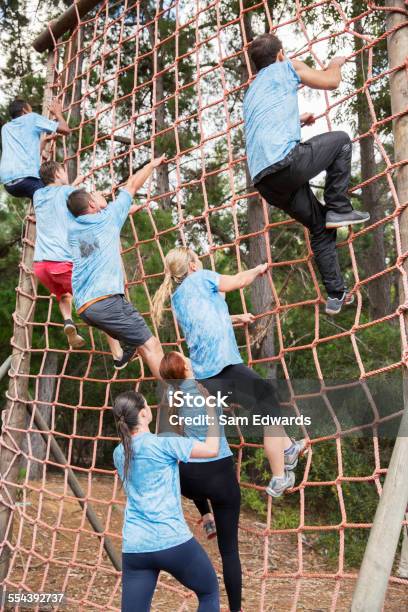 Military Soldiers Climbing Rope During Obstacle Course Stock Photo -  Download Image Now - iStock