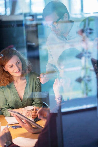 istock Business people talking in office meeting 555799333