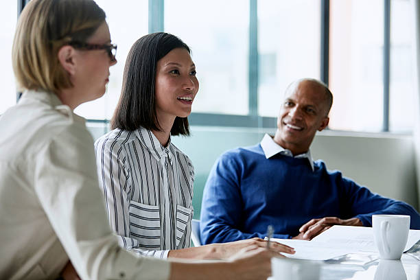 Businesswoman having discussion with colleagues
