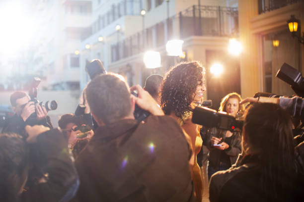 istock Paparazzi photographing celebrity at event 559536465