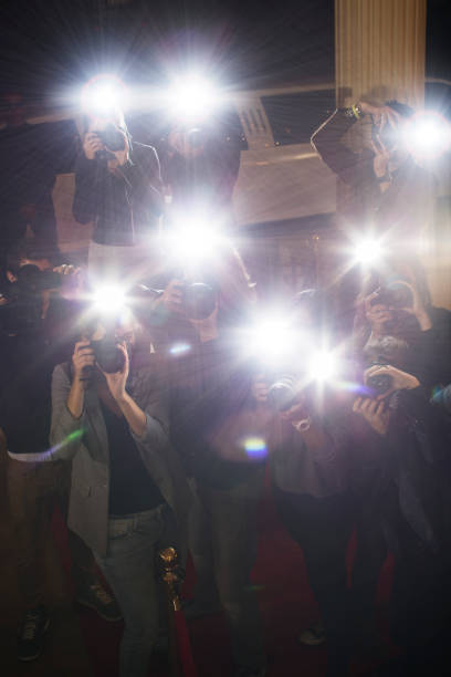 istock Paparazzi photographers at red carpet event 559536733