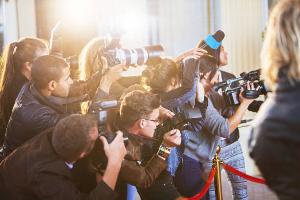 istock Paparazzi photographers at red carpet event 559536735