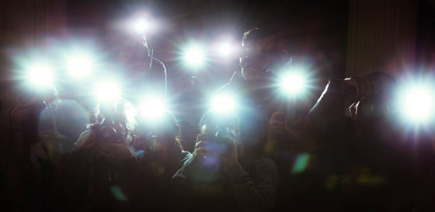 Lens flash of paparazzi photographers cameras  red carpet event photos stock pictures, royalty-free photos & images