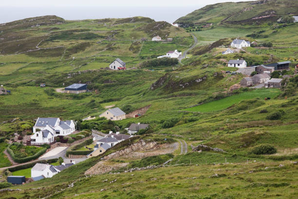 istock Houses along green hillside, Donegal, Ireland 559537603