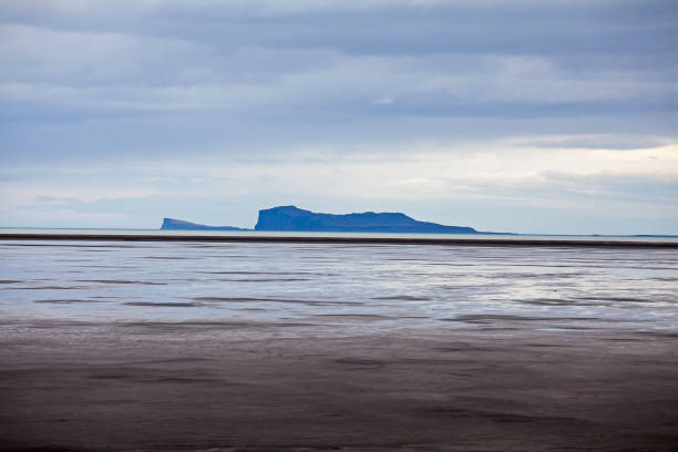 istock Seascape and distant island, Iceland 559537681