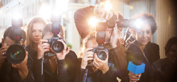 Portrait of paparazzi in a row with cameras and microphone  tv reporter photos stock pictures, royalty-free photos & images