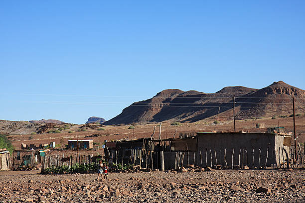 istock Houses On Desert Landscape With Mountains In Background 559552859