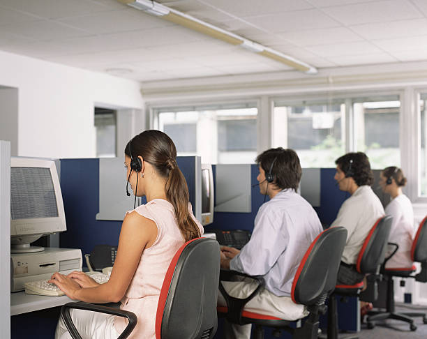 Call centre workers,  office cubicle stock pictures, royalty-free photos & images