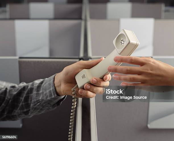 Man Handing Telephone Receiver To Woman Stock Photo - Download Image Now - Call Center, Human Hand, Passing - Giving