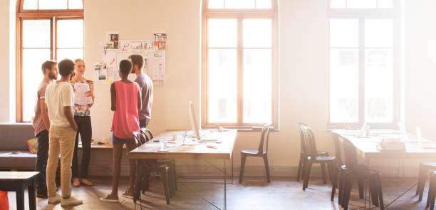 istock Creative business people meeting in sunny office 562873153