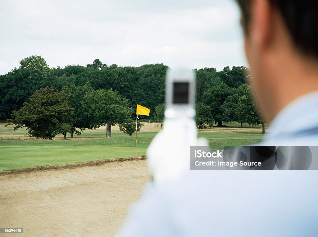 Golfista con teléfono con cámara - Foto de stock de Agarrar libre de derechos