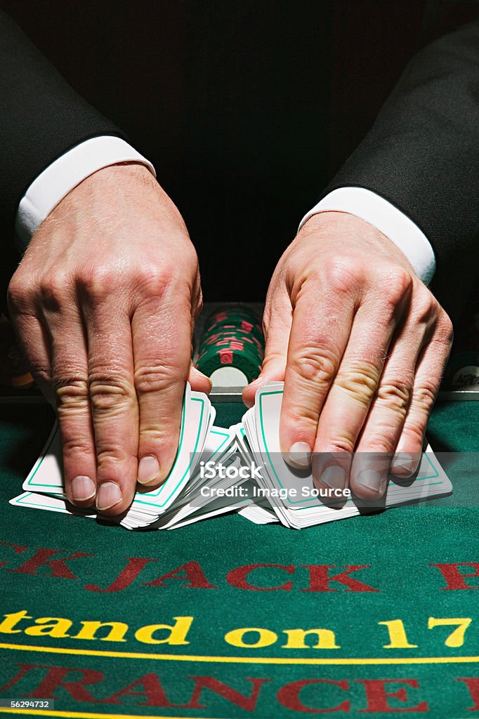 Dealer shuffling cards  Playing Card Stock Photo