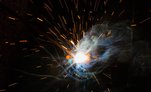 istock SMAW – Shielded metal arc welding and welding fumes. 564559450