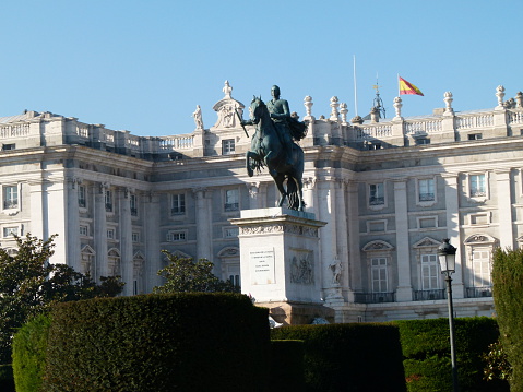 Madrid, Spain - January 2, 2011: The Royal Palace Palacio Real in Madrid, Spain. Photo taken during the day from the square in front, and contains tourists and locals walking about.