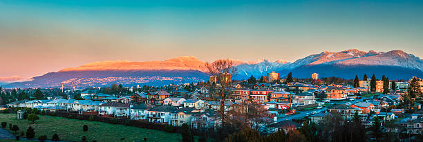North Burnaby at Dawn North Burnaby homes, British Columbia, Canada with beautiful North Shore mountains in the background. west vancouver stock pictures, royalty-free photos & images