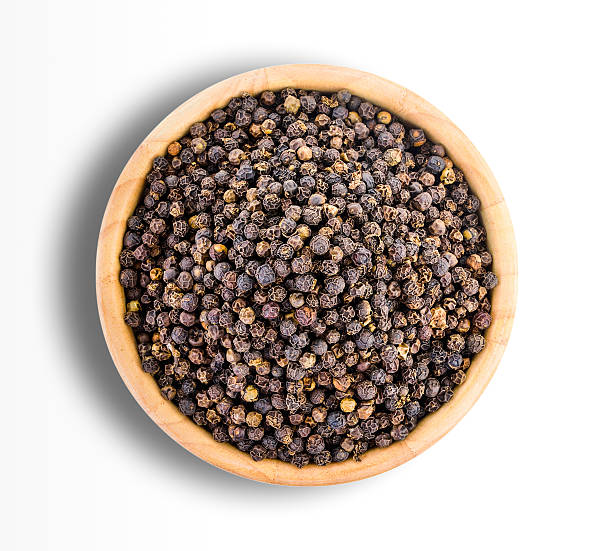 istock peppercorn in wood bowl isolated on white background 564561778