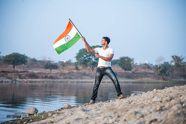 indian young man waving indian flag
