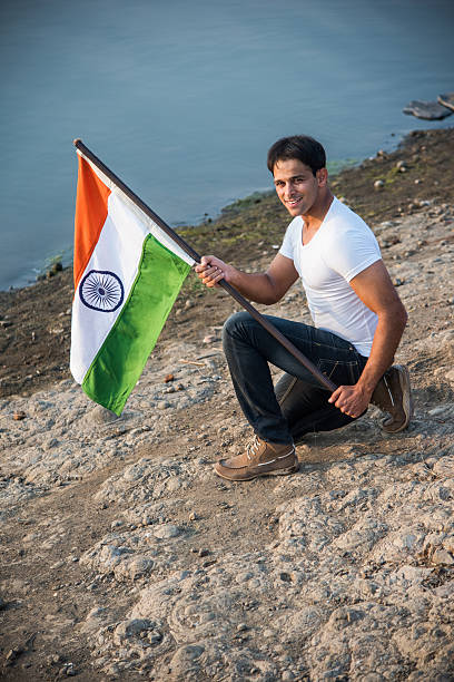 istock indian young man waving indian flag 564562414