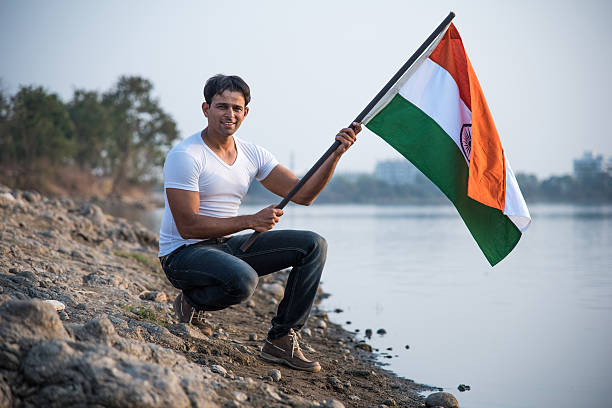 istock indian young man waving indian flag 564562482