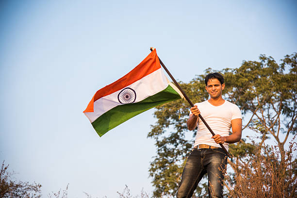 istock indian young man waving indian flag 564562804