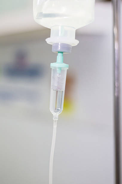 istock saline solution IV in hospital room 564564998