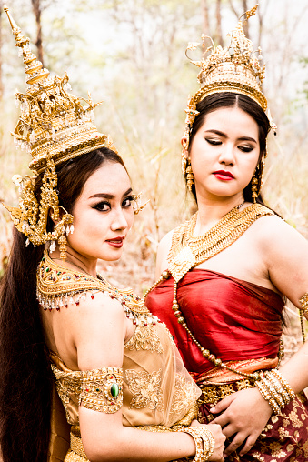 Two Thai models wearing traditional costumes.