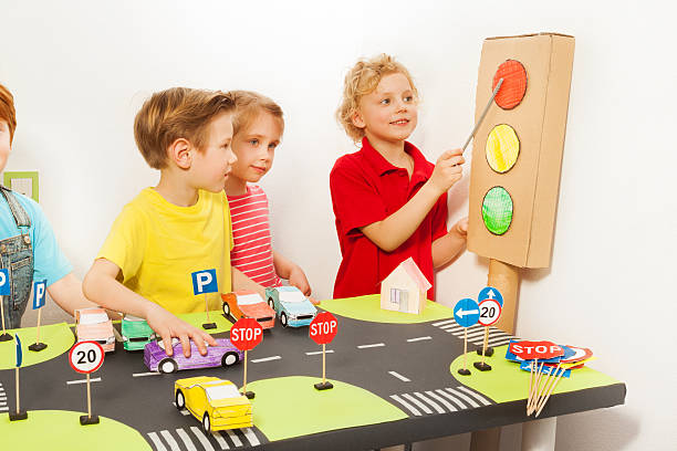 istock Friends playing drivers at road safety class 564569156