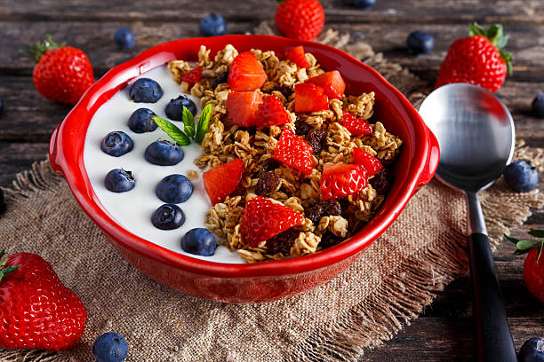istock Homemade granola Breakfast with yogurt and fresh fruit berries. concepts 564569902