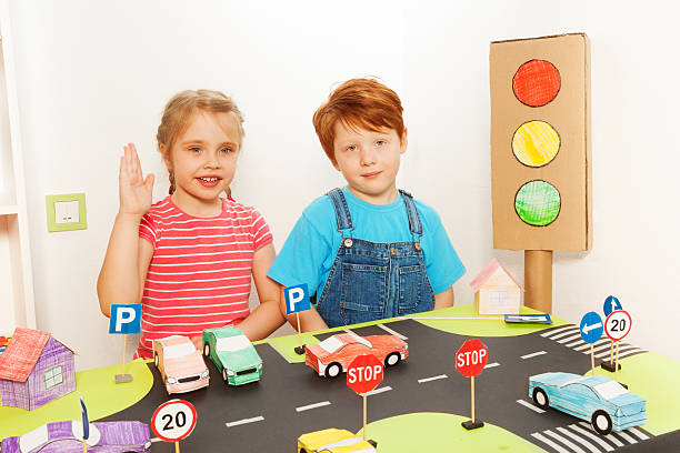 istock Boy and girl studying road traffic regulations 564571340