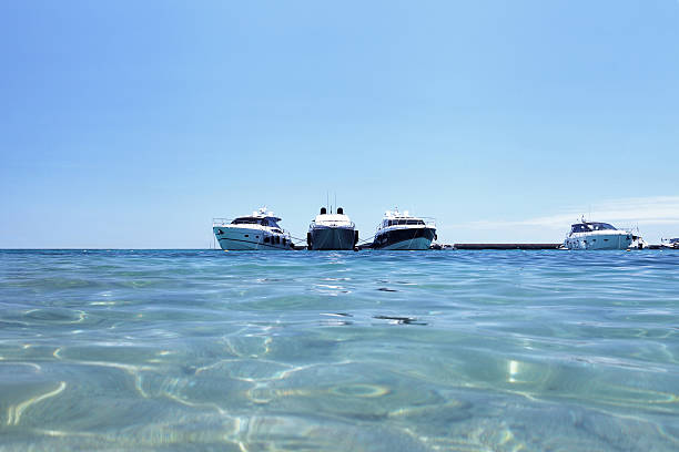 istock luxury boats on the beach 564572280