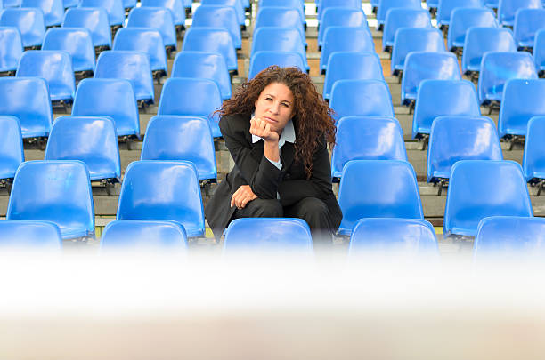 istock Bored young woman sitting waiting 564573592