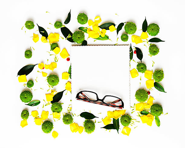 istock Glasses and paper with pattern from petals. 564573916