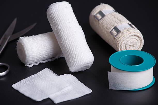istock Medical bandages with scissors and sticking plaster 564574126