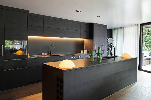 Interior, Modern kitchen Modern kitchen with black furniture and wooden floor domestic kitchen stock pictures, royalty-free photos & images