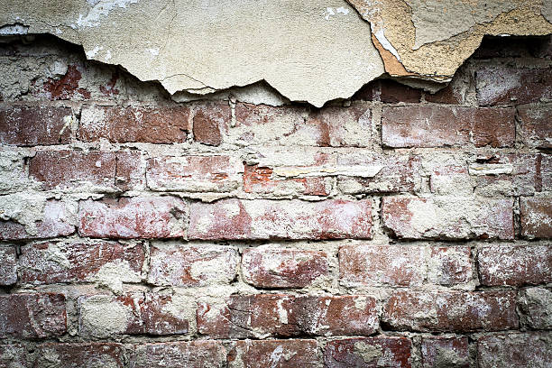 istock Old brick with concrete crack. Grunge background 564578328
