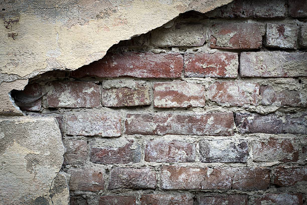 istock Old brick with concrete crack. Grunge background 564578660