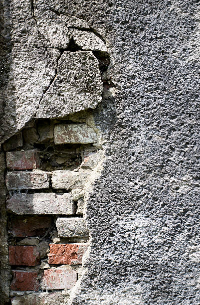 istock Old brick with concrete crack. Grunge background 564578818