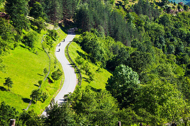 Aerial view of three motorcyclists on a rural road stock photo