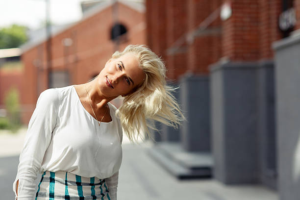 istock beautiful blonde hair shakes 564579726