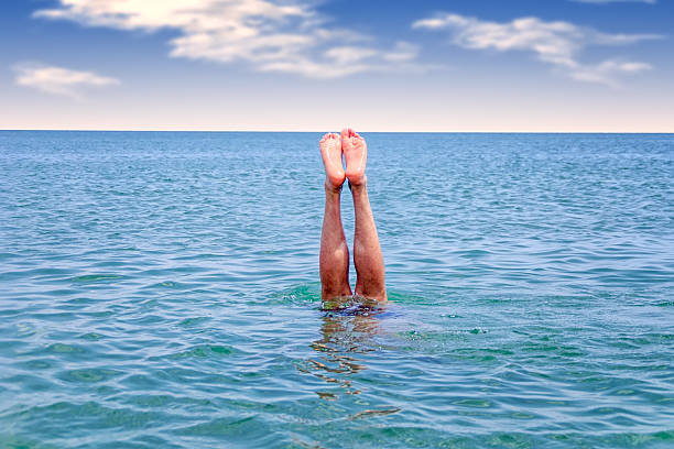 istock feet sea dives 564579738