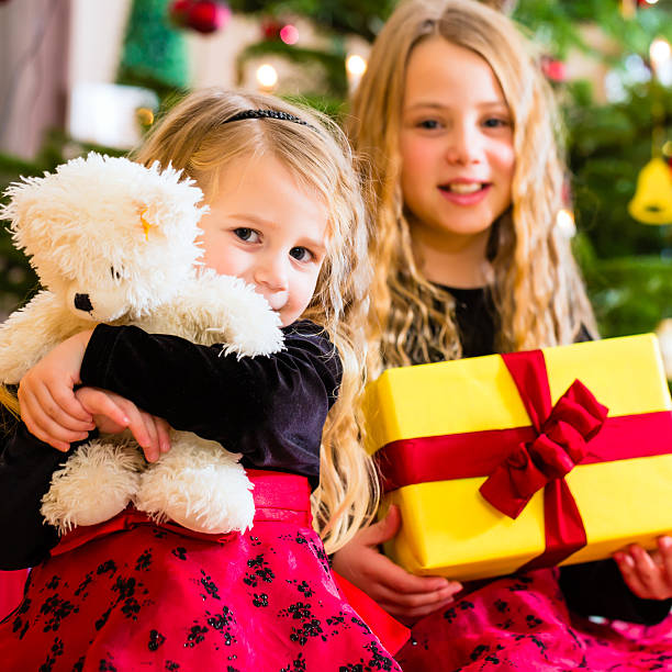 istock Children receiving presents on Christmas day 564579946