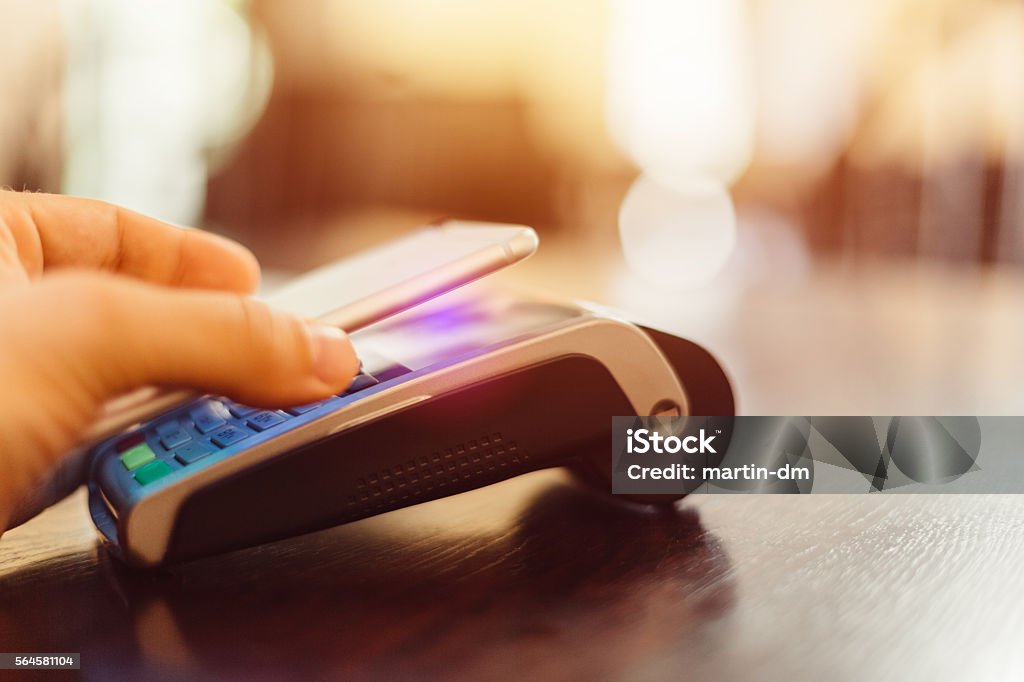 Contactless payment Man using smartphone for contactless payment Contactless Payment Stock Photo