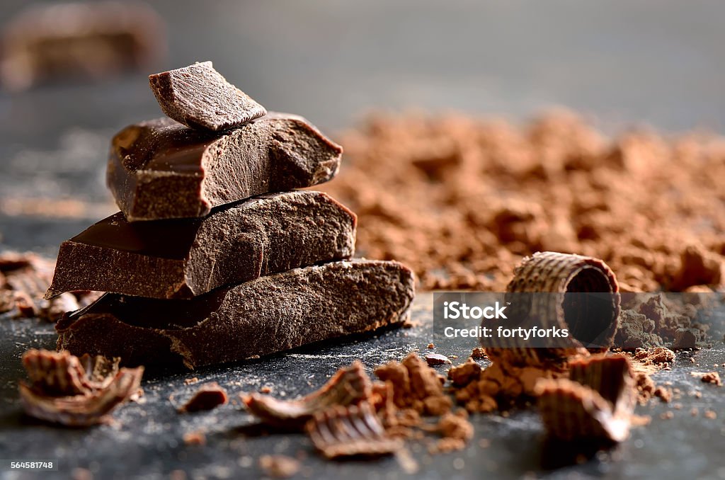Dark chocolate Dark chocolate stack, chips and powder Black Color Stock Photo