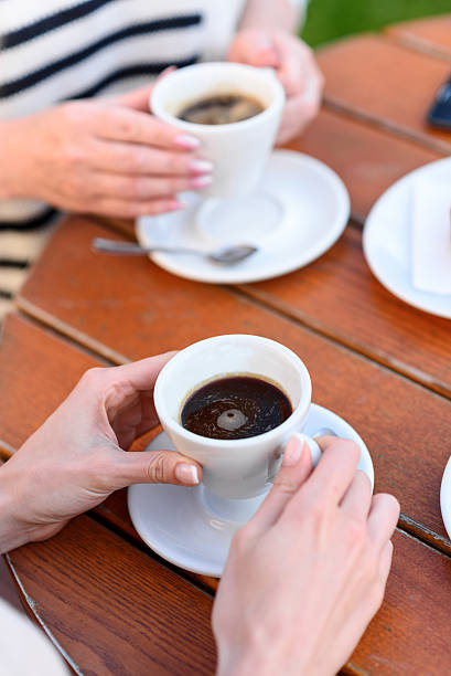 istock Two ladies enjoying hot drink in cafeteria 564583262