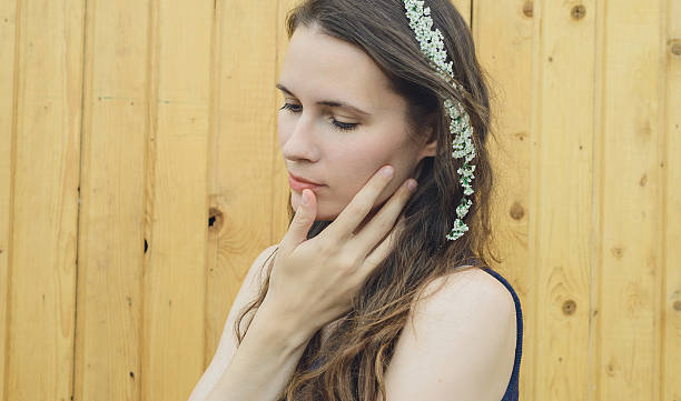 istock flowers branches spirea on head young girl 564585362