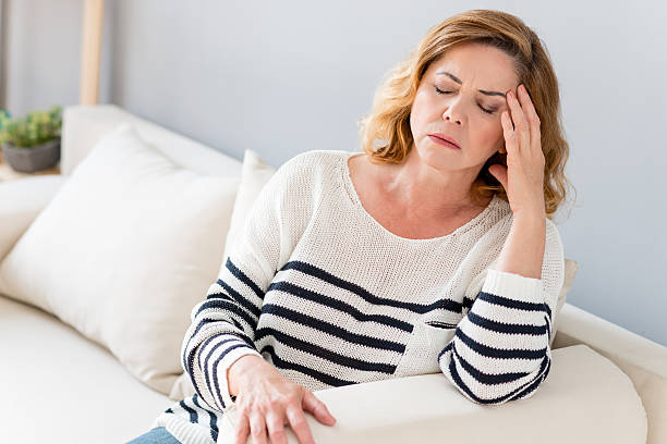 istock Senior lady feels pain in head 564587938